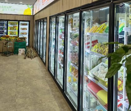Glass door coolers in a supermarket aisle