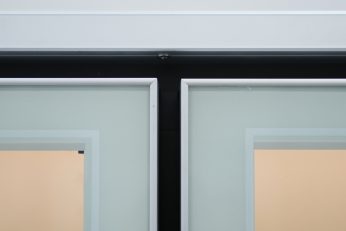 Frameless glass door corner detail