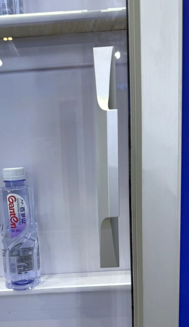 Sliding glass display door shown open at the cabinet
