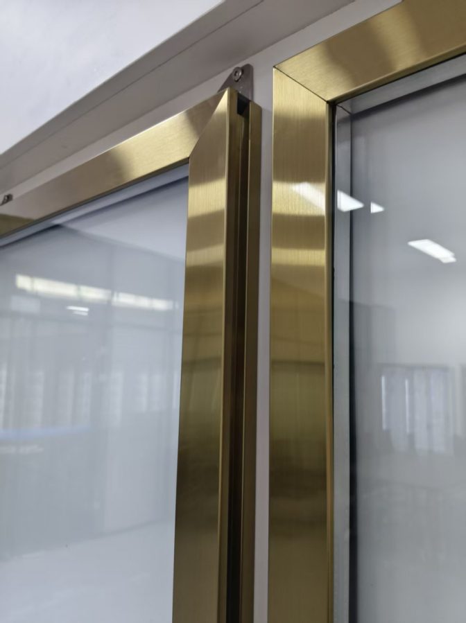 Titanium frame glass doors in a retail display corridor